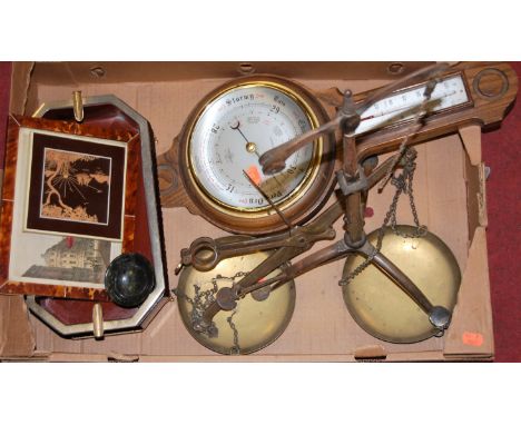 A box of miscellaneous items to include a set of beamscales and an early 20th century oak cased aneroid barometer etc