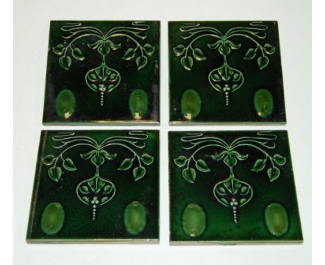 A collection of six Art Nouveau green glazed ceramic tiles 15x15cm