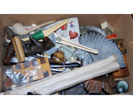 A box of miscellaneous items, to include; glove-stretchers, enamel badges, clay pipe, pocket knife, corkscrew etc 