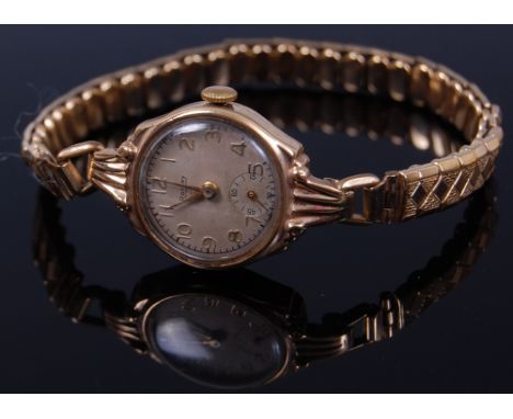 A ladies Rotary 9ct gold cased wristwatch having a signed silvered dial, subsidiary seconds dial, manual wind movement on rep