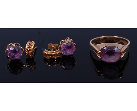 A modern 9ct gold and amethyst set dress ring, 4.1g, together with a pair of 9ct gold amethyst set ear studs, and a pair of y