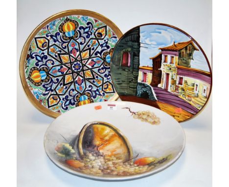 A large 20th century continental charger handpainted with various grapes and fruit, signed indistinctly, dia. 41cm, together 