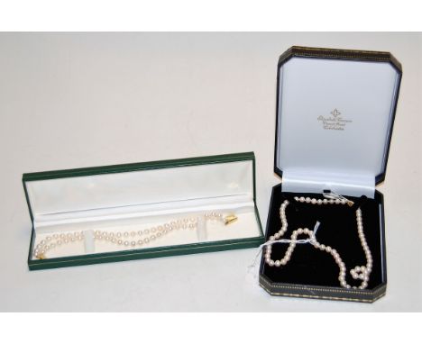 A ladies Miki-Moto single string pearl necklace having a 9ct gold bow clasp