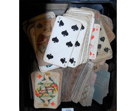 A box of assorted early playing cards