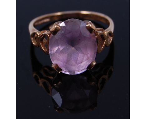 A modern 9ct gold and four claw oval cut amethyst set dress ring, 3g, size N   Condition Report / Extra Information  Small ab