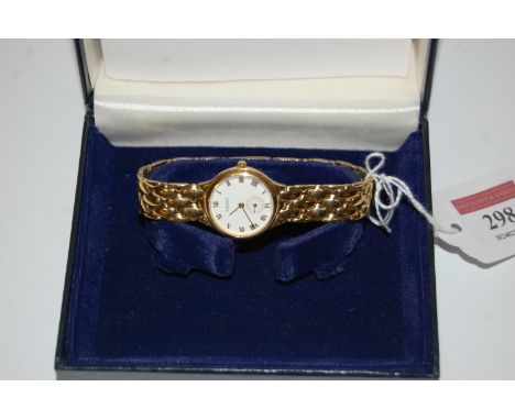 A ladies Tissot gold plated cased and steel back wrist watch having enamel dial with gilt Roman numerals and subsidiary secon