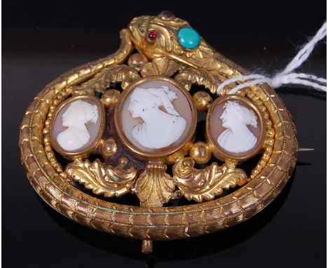 A Victorian gilt metal carved shell cameo set brooch, the whole in snake surround, further set with turquoise and ruby glass 