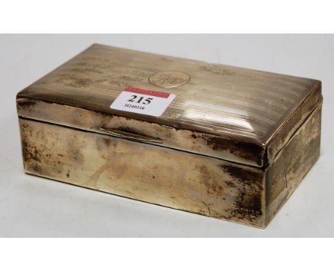 A Geroge VI silver table cigarette box having engine turned lid