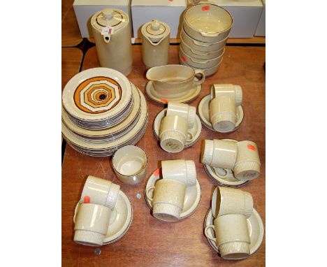 A modern Poole pottery part tea and dinner service on a pale yellow ground with red flecked decoration
