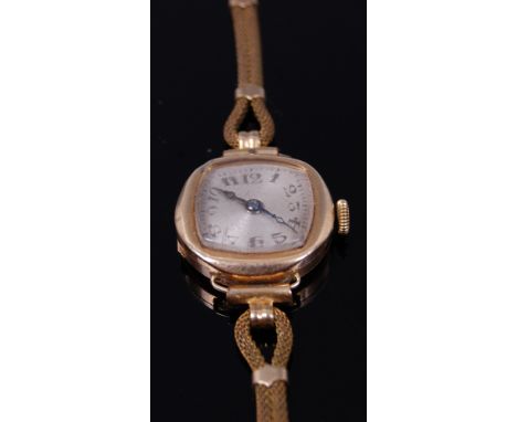 A ladies vintage 15ct gold cased cocktail watch, having unsigned silvered dial, manual wind movement, and on gilt metal meshl