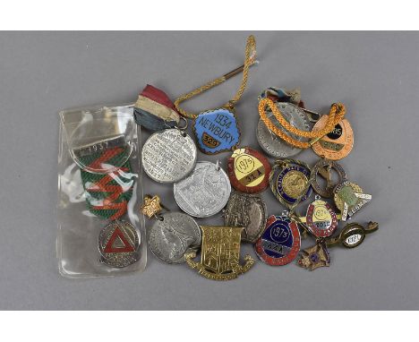 A small collection of Newbury race course enamel badges, from 1912, 1934 and later together with Victoria commemorative zinc 