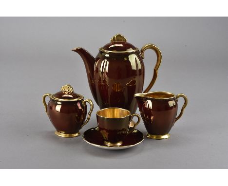 Three Carltonware art deco coffee sets, each comprising coffee pot, cream jug, sugar bowl and six cans and saucers including 