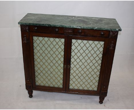 A 19th Century mahogany and marble topped pier cabinet, having grille fronted panel doors to two shelf interior, 93 cm x 32 c