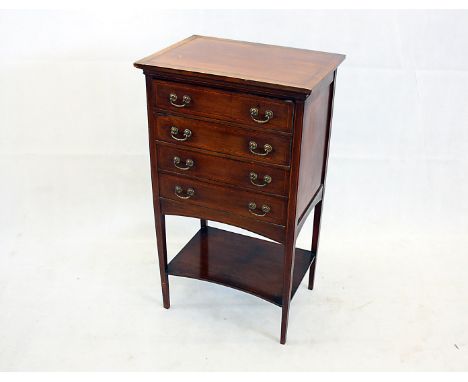 An Edwardian mahogany and satin, boxwood and ebony banded music sheet cabinet, four drawers shaped apron straight legs united