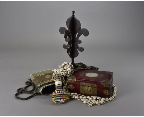 A collection of ethnographical items, including a Persian metal purse, a Chinese hardstone inlaid box, a fabric stamp, two be