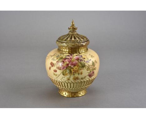 A Royal Worcester blush ivory pot pourri, of ovoid form with floral spray above a basket style moulded design with circular c