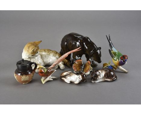 A collection of ceramic ornaments, including a Hutschenreuther golden pheasant, butterfly, brown bear and grape eating finch,