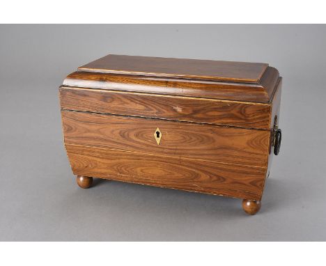 A 19th century Macassar ebony tea caddy, fitted with the original twin tea compartments and sugar bowl, the lid lined with bu