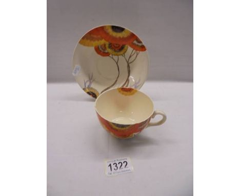 A Clarice Cliff Bizarre Rhodanthe pattern tea cup and saucer.