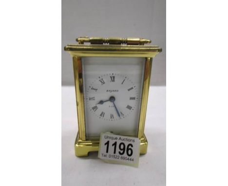 A Bayard brass carriage clock in working order, 11.5 cm tall.