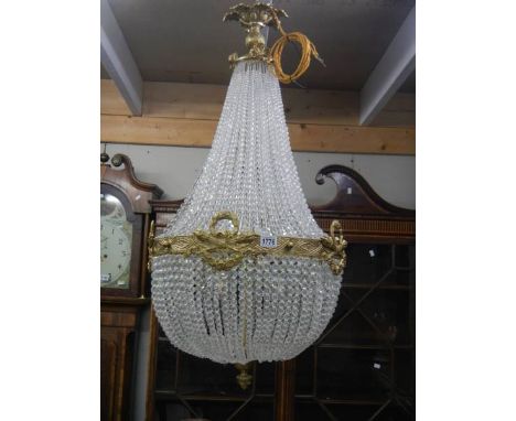 A mid 20th century brass and glass 'basket' chandelier, COLLECT ONLY.Diameter 55 cm approximately,Drop 105cm approximately.