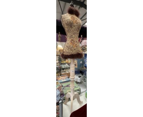 A Mannequin in an abstract jacquard bodice with feather trim (with extension pole)