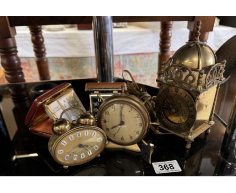 A Smiths electric brass lantern clock and Smiths empire ships wheel clock and 3 others