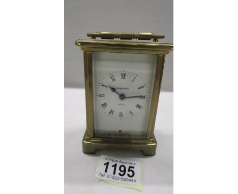 A Bayard brass carriage clock in working order, 11.5 cm tall.