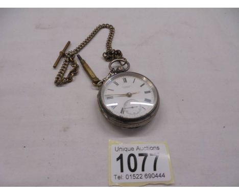 A silver pocket watch (Hannford, Poole) on a brass Albert.
