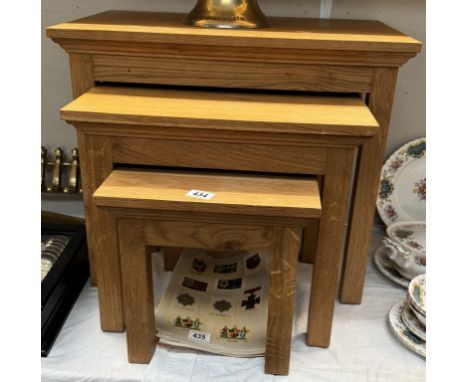 A nest of light oak tables