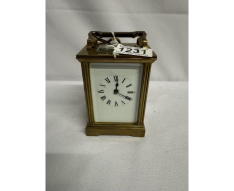 A brass carriage clock with key and in working order.