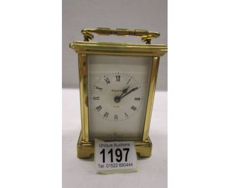A Bayard brass carriage clock in working order, 11.5 cm tall.