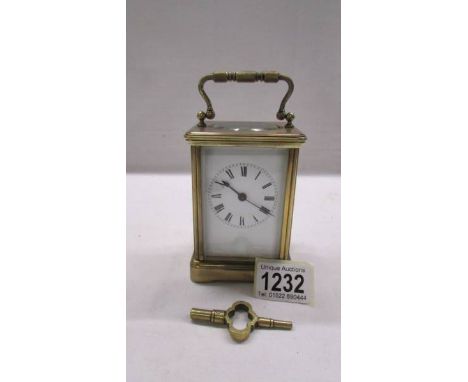 A brass carriage clock with key and in working order.