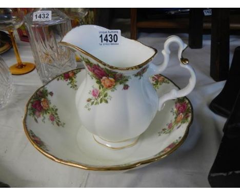 A Royal Albert Old Country Roses jug and basin set.