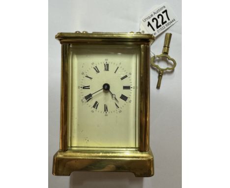 A brass carriage clock with key and in working order.