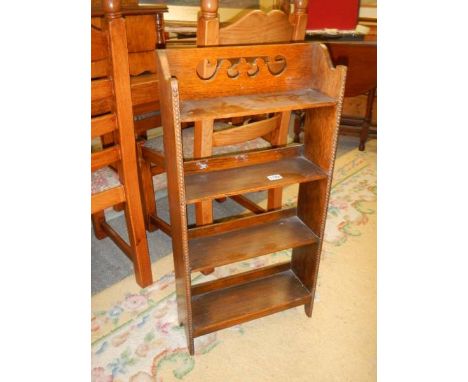 A mid 20th century oak four shelf book case. COLLECT ONLY.