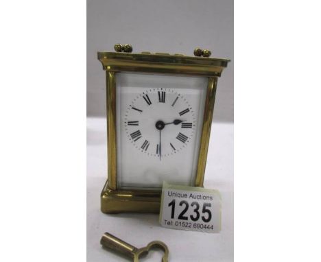 A brass carriage clock with key and in working order.