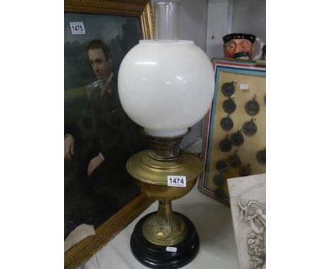 An early 20th century brass oil lamp.