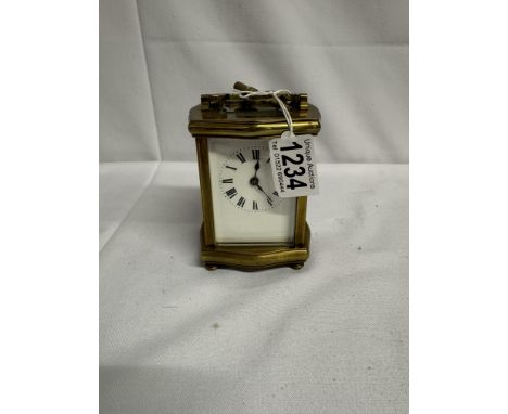 A brass carriage clock with key and in working order.