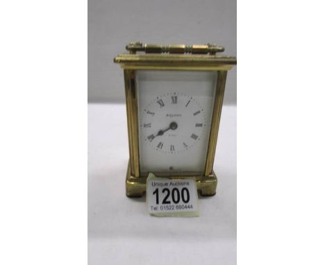 A Bayard brass carriage clock in working order, 11.5 cm tall.