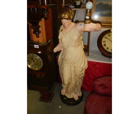 A tall female figure as a lamp, right arm damaged. COLLECT ONLY.