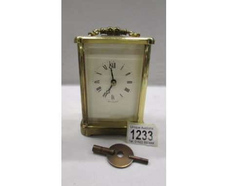 A brass carriage clock with key and in working order.