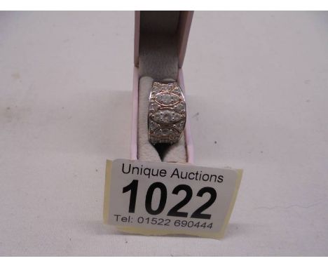 A silver (925) ring set clear stones, size S.