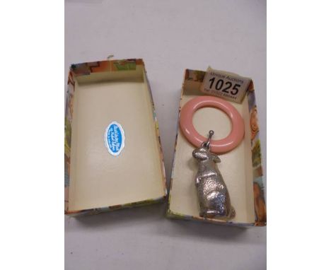 A boxed circa 1950's babies rattle/teething ring as a rabbit.