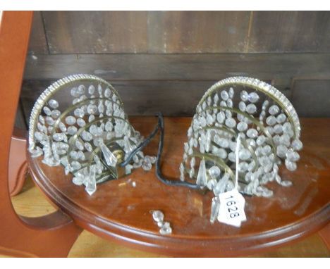 A pair of chandelier style wall lights.