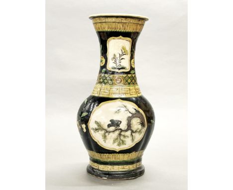 A Chinese Famille noir decorated stoneware vase, drilled as a lamp base, H. 42cm.