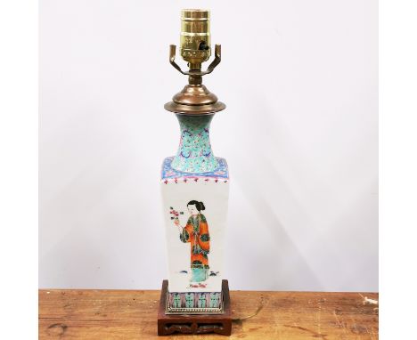 A 19th/early 20th C Chinese porcelain vase mounted as a table lamp on a carved hardwood base, H. 39cm.