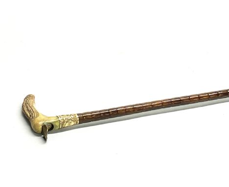 A Luce Hoskins antler handled and gold plated walking stick inset with a compass with partridge cane stem, L. 83cm.