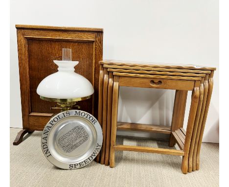 A nest of four carved teak tables with an oak fire screen and two other items.