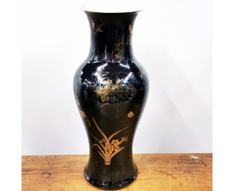 A lovely Chinese black glazed and gilt porcelain vase, H. 43cm, six character mark to base for Kangxi. Probably of the period